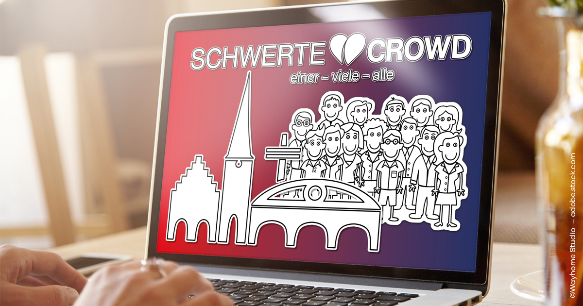 Es ist ein Laptop zu sehen, auf dessen Bildschirm das Logo der Schwerte Crowd zu sehen ist.