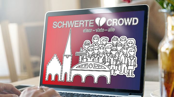 Auf dem Display von einem Laptop sieht man das Logo der Schwerte Crowd.